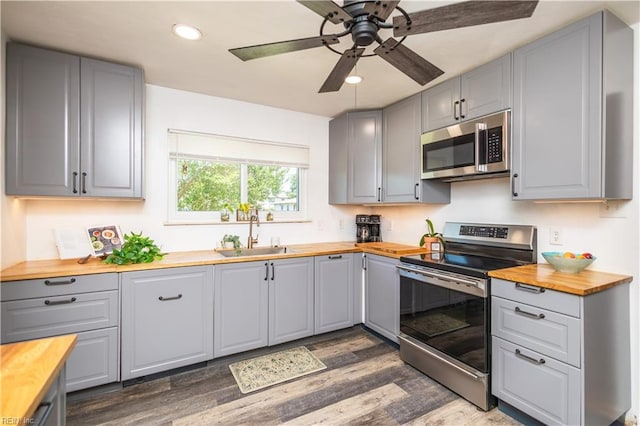 708 Houdon Ln, Virginia Beach, VA 23455 - kitchen featuring appliances with stainless steel finishes, wooden counters, a sink, gray cabinetry, and dark wood finished floors