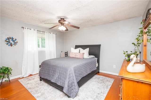 708 Houdon Ln, Virginia Beach, VA 23455 - bedroom with wood finished floors, a textured ceiling, a ceiling fan, and baseboards