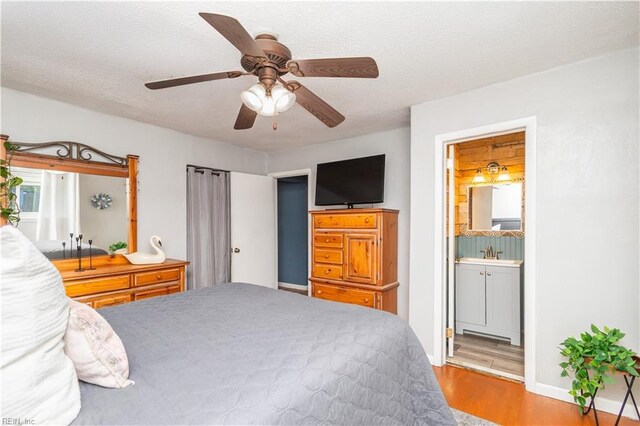 708 Houdon Ln, Virginia Beach, VA 23455 - bedroom featuring wood finished floors, ensuite bathroom, baseboards, and a ceiling fan