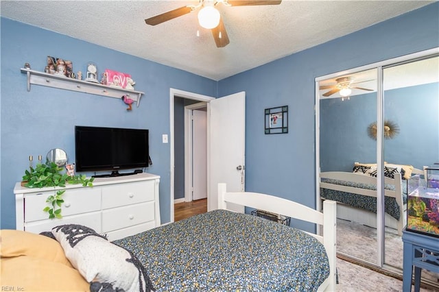 708 Houdon Ln, Virginia Beach, VA 23455 - bedroom with ceiling fan, a textured ceiling, a closet, and wood finished floors