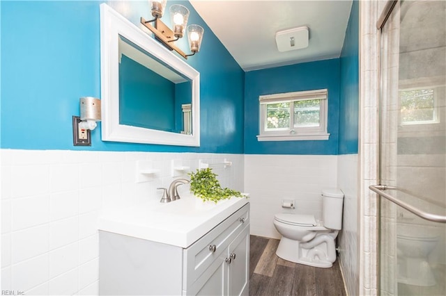 708 Houdon Ln, Virginia Beach, VA 23455 - full bath featuring toilet, tile walls, vanity, wood finished floors, and a stall shower