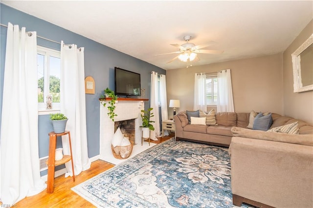 708 Houdon Ln, Virginia Beach, VA 23455 - living area with ceiling fan, light wood-type flooring, a fireplace, and baseboards