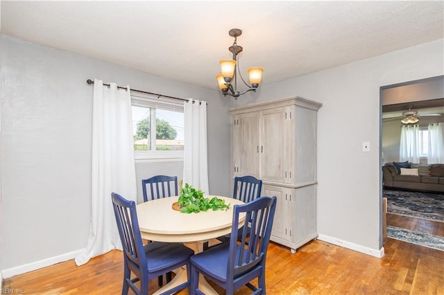 708 Houdon Ln, Virginia Beach, VA 23455 - dining area featuring light wood finished floors, a chandelier, and baseboards