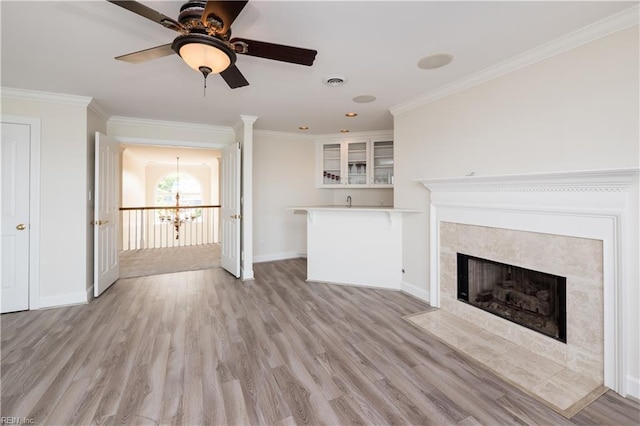 2365 Haversham Close Close, Virginia Beach, VA 23454 - unfurnished living room featuring baseboards, crown molding, light wood-style flooring, a tile fireplace, and a chandelier