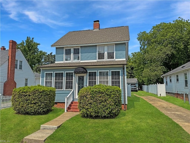 114 Maple Ave, Newport News, VA 23607 - view of front facade featuring entry steps, a shingled roof, and a chimney