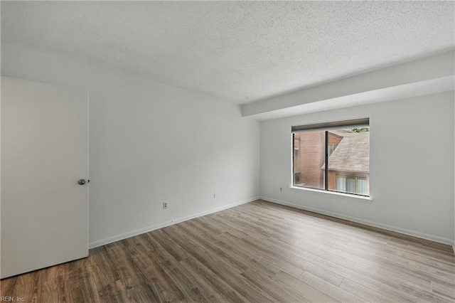 321 Bantry Cross Cross, Virginia Beach, VA 23452 - unfurnished room with wood finished floors, a textured ceiling, and baseboards