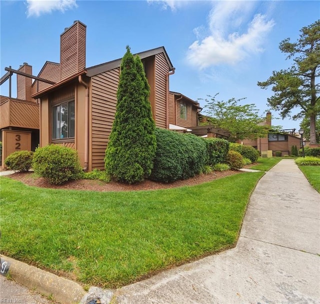 321 Bantry Cross Cross, Virginia Beach, VA 23452 - view of property exterior with a chimney and a yard