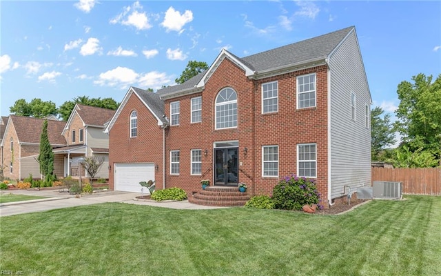 2129 Bierce Dr, Virginia Beach, VA 23454 - colonial-style house featuring driveway, an attached garage, central AC, and brick siding