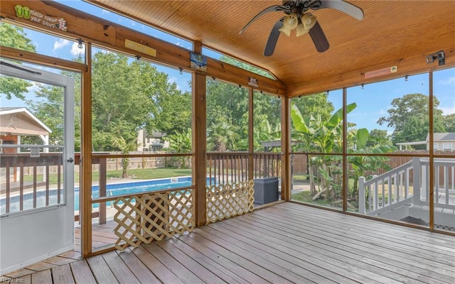 2129 Bierce Dr, Virginia Beach, VA 23454 - unfurnished sunroom with a ceiling fan, plenty of natural light, lofted ceiling, and view of scattered trees