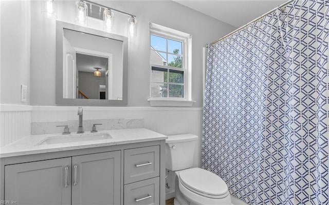 2129 Bierce Dr, Virginia Beach, VA 23454 - full bathroom with a wainscoted wall, vanity, toilet, and curtained shower