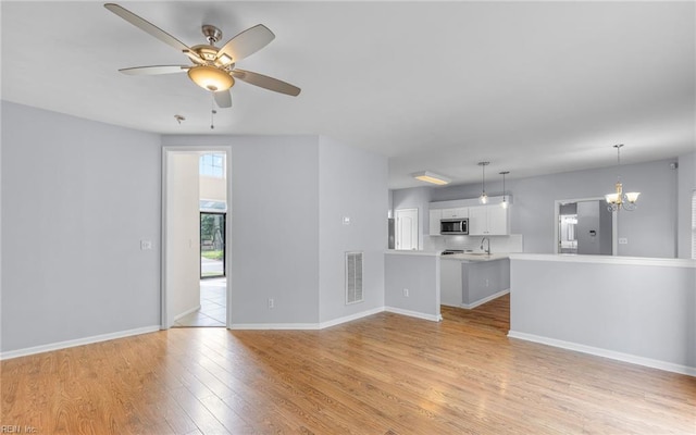 2129 Bierce Dr, Virginia Beach, VA 23454 - unfurnished living room featuring a ceiling fan, a sink, light wood-style flooring, and baseboards