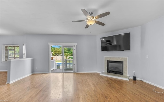 2129 Bierce Dr, Virginia Beach, VA 23454 - unfurnished living room featuring wood finished floors, a high end fireplace, baseboards, and a ceiling fan