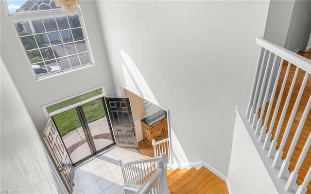 2129 Bierce Dr, Virginia Beach, VA 23454 - stairs featuring a high ceiling, french doors, and baseboards