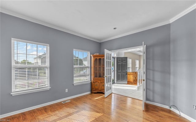 2129 Bierce Dr, Virginia Beach, VA 23454 - spare room with crown molding, baseboards, and wood finished floors