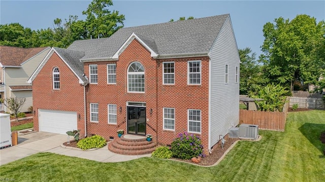 2129 Bierce Dr, Virginia Beach, VA 23454 - colonial house with central AC, an attached garage, brick siding, and concrete driveway