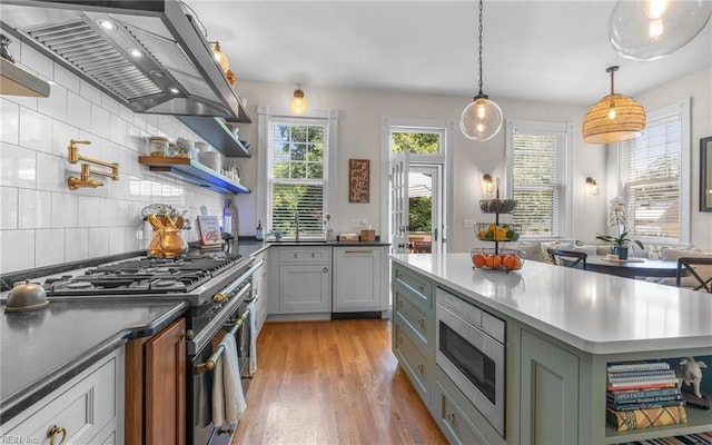 5312 Studeley Ave, Norfolk, VA 23508 - kitchen featuring appliances with stainless steel finishes, wall chimney range hood, open shelves, light wood-style flooring, and gray cabinets