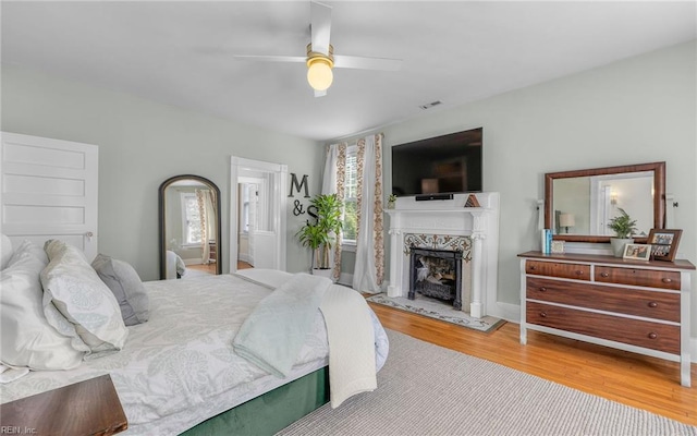 5312 Studeley Ave, Norfolk, VA 23508 - bedroom with wood finished floors, a fireplace, and ceiling fan