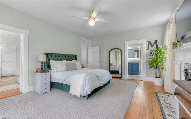 5312 Studeley Ave, Norfolk, VA 23508 - bedroom featuring light wood finished floors, ensuite bath, ceiling fan, and baseboards