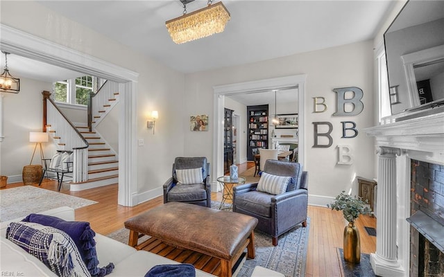 5312 Studeley Ave, Norfolk, VA 23508 - living area with a fireplace, stairway, hardwood / wood-style floors, and baseboards