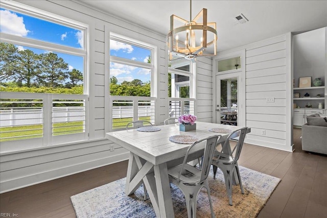 909 Los Colonis Dr, Virginia Beach, VA 23456 - dining space with a chandelier and dark wood-style floors