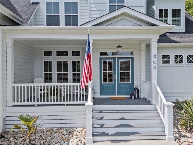 909 Los Colonis Dr, Virginia Beach, VA 23456 - view of exterior entry featuring a porch and roof with shingles