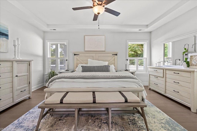 909 Los Colonis Dr, Virginia Beach, VA 23456 - bedroom featuring a raised ceiling, dark wood-style floors, baseboards, and a ceiling fan