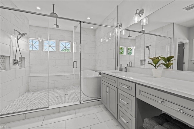 909 Los Colonis Dr, Virginia Beach, VA 23456 - bathroom with marble finish floors, a soaking tub, a stall shower, double vanity, and tile walls