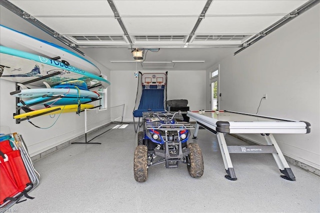 909 Los Colonis Dr, Virginia Beach, VA 23456 - garage featuring a garage door opener and baseboards