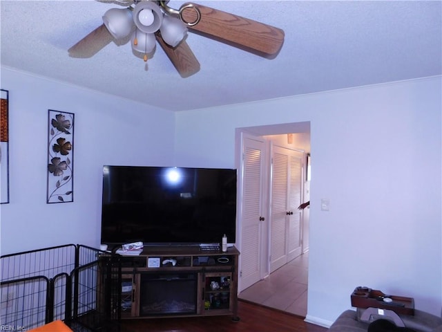 4193 Thistle Cir, Virginia Beach, VA 23462 - living area featuring wood finished floors, a ceiling fan, and crown molding
