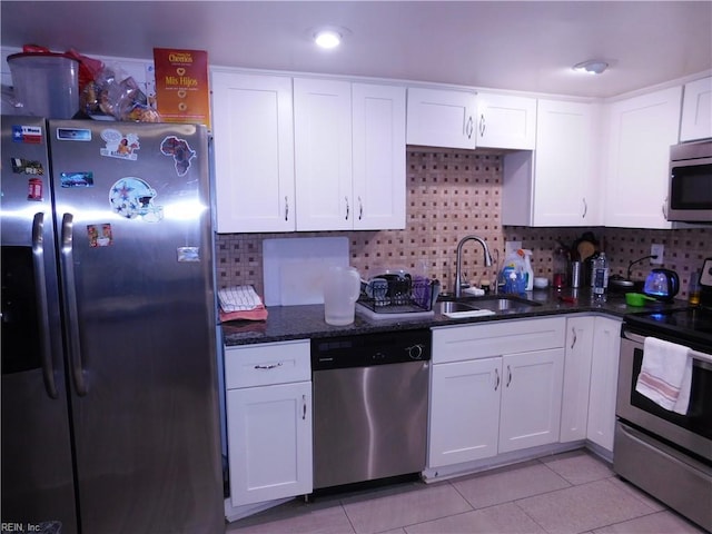 4193 Thistle Cir, Virginia Beach, VA 23462 - kitchen featuring appliances with stainless steel finishes, a sink, white cabinetry, and tasteful backsplash