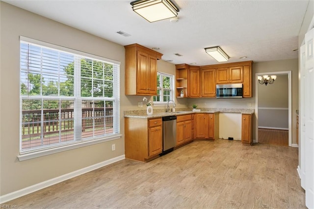 18 Welcome Way, Hampton, VA 23666 - kitchen with appliances with stainless steel finishes, open shelves, brown cabinetry, and a chandelier