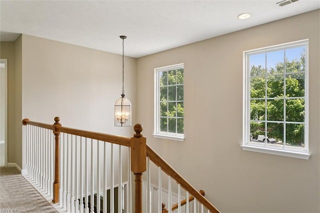 18 Welcome Way, Hampton, VA 23666 - hall featuring a chandelier, carpet flooring, an upstairs landing, and baseboards