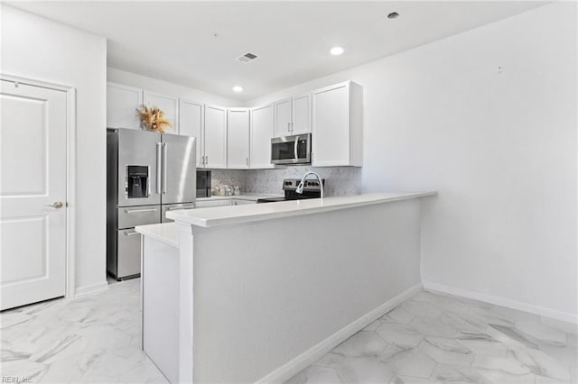 1733 Dromolin St Unit 205, Virginia Beach, VA 23456 - kitchen featuring stainless steel appliances, light marble finish flooring, light countertops, a peninsula, and recessed lighting