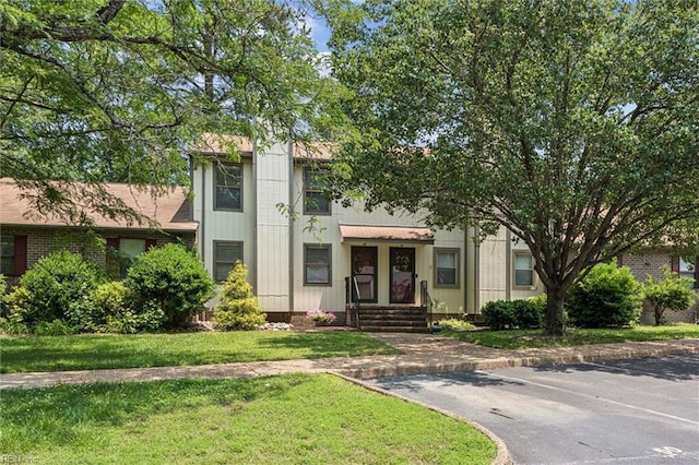 50 James Sq, Williamsburg, VA 23185 - view of front of home with uncovered parking and a front yard