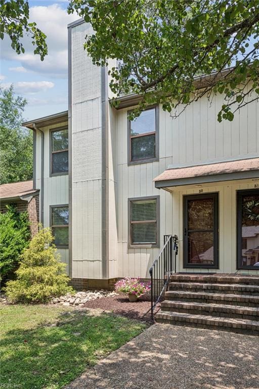 50 James Sq, Williamsburg, VA 23185 - property entrance with a chimney