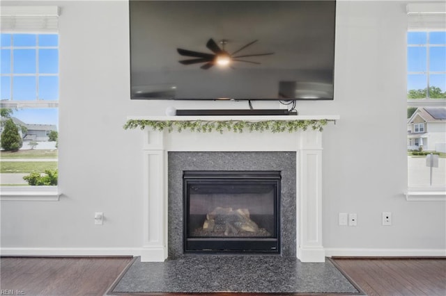 637 Wood Nymph Ln, Chesapeake, VA 23323 - detailed view of ceiling fan, wood finished floors, a fireplace with flush hearth, and baseboards