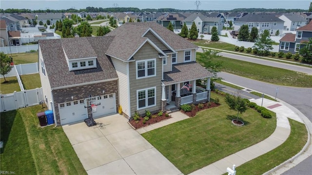 637 Wood Nymph Ln, Chesapeake, VA 23323 - view of front of house with a porch, a garage, a residential view, concrete driveway, and a gate