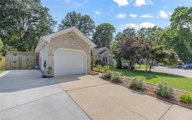 1813 Castleton Ct, Virginia Beach, VA 23454 - view of front facade with concrete driveway, brick siding, an attached garage, and a gate