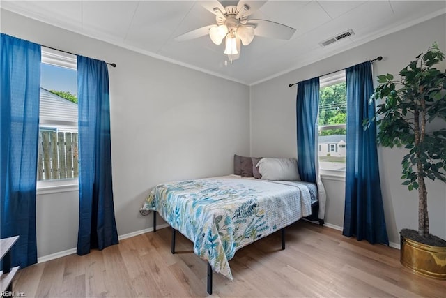 423 Cedar Dr, Hampton, VA 23669 - bedroom featuring light wood-type flooring, ornamental molding, ceiling fan, and baseboards