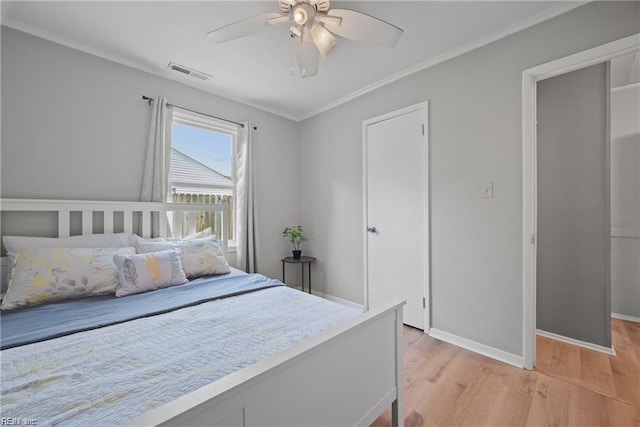 423 Cedar Dr, Hampton, VA 23669 - bedroom featuring light wood-type flooring, baseboards, a ceiling fan, and crown molding
