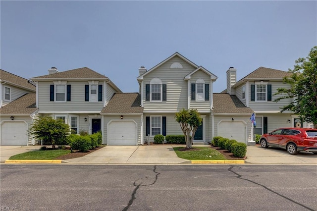 1808 Kensal Green Dr, Virginia Beach, VA 23456 - view of front of house featuring driveway, an attached garage, and a chimney