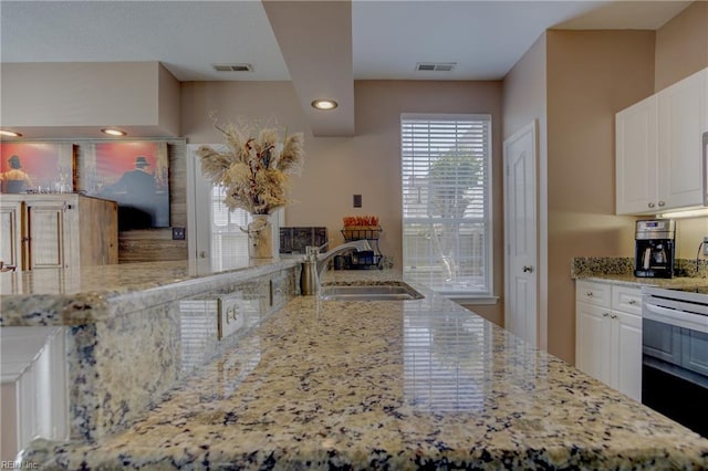 1808 Kensal Green Dr, Virginia Beach, VA 23456 - kitchen featuring a sink, electric range, light stone countertops, white cabinets, and recessed lighting