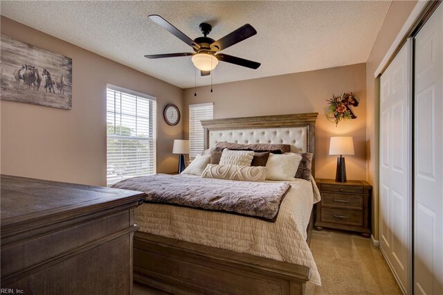 1808 Kensal Green Dr, Virginia Beach, VA 23456 - bedroom with a closet, light carpet, a textured ceiling, and a ceiling fan