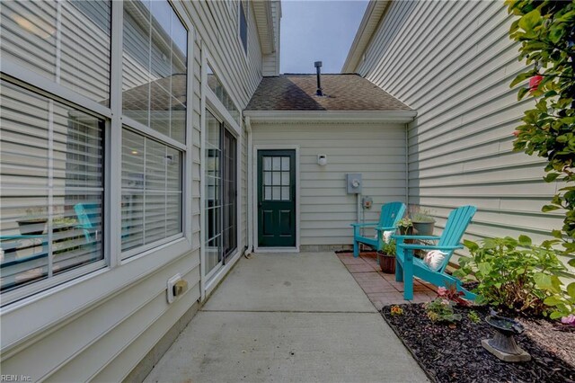 1808 Kensal Green Dr, Virginia Beach, VA 23456 - entrance to property featuring a shingled roof and a patio