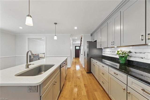 315 N Second St, Hampton, VA 23664 - kitchen with a sink, light wood-style flooring, ornamental molding, backsplash, and appliances with stainless steel finishes