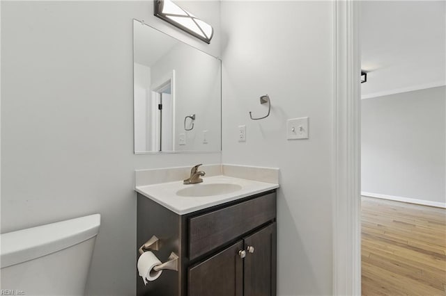 315 N Second St, Hampton, VA 23664 - half bath with vanity, toilet, wood finished floors, and ornamental molding