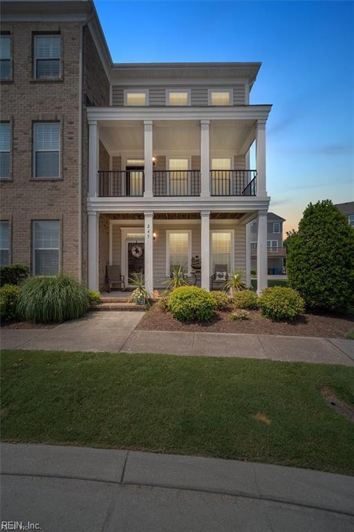 245 Feldspar St, Virginia Beach, VA 23462 - neoclassical home with a balcony, a porch, and a lawn