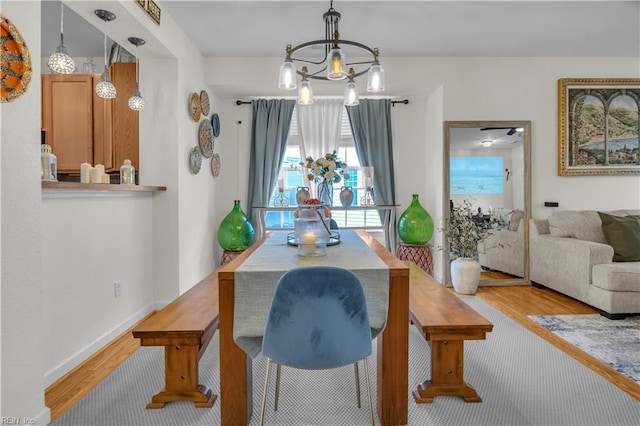 245 Feldspar St, Virginia Beach, VA 23462 - dining space featuring a chandelier, wood finished floors, and baseboards