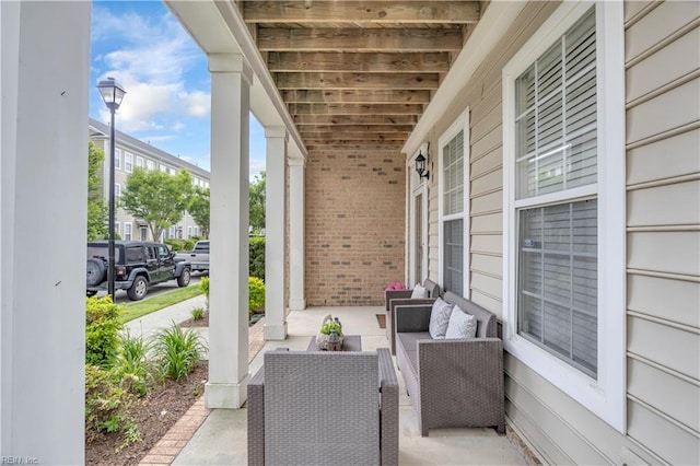 245 Feldspar St, Virginia Beach, VA 23462 - covered porch featuring an outdoor hangout area