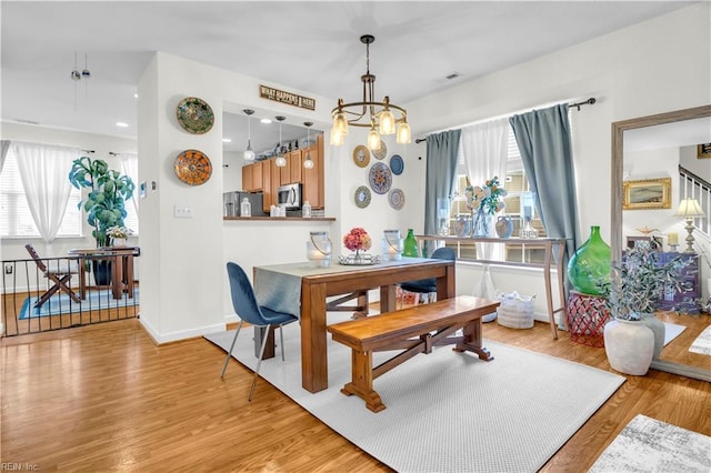 245 Feldspar St, Virginia Beach, VA 23462 - dining area with a chandelier, light wood-type flooring, and baseboards